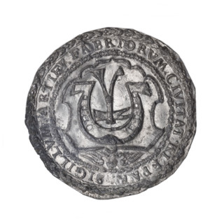 Seal of the Blacksmiths' Guild. Bronze seal (rim-inscribed) depicting on the decorated inner rim a