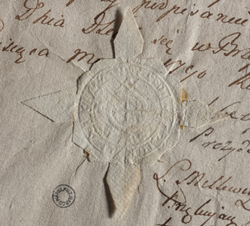Round seal impression of the city of Brzesc Kujawski. In the rim an equal-armed cross. The rim