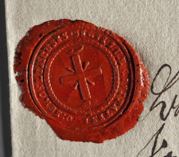 Wax impression of the seal of Góra Kalwaria. An equal-armed cross with rays emanating from the arms