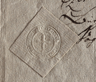 Round seal impression of the town of Góra Kalwaria. A cross on the hill. Illegible inscription on
