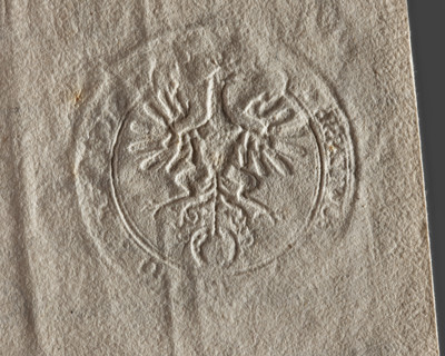 Round seal impression of the town of Grzybowo, Masovian Voivodeship. Single-headed crowned eagle
