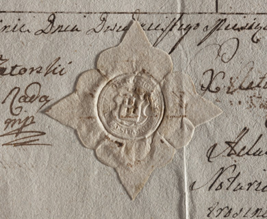 Round seal impression of the town of Jutroszyn, Kalisz Voivodeship. On the shield there is a wall