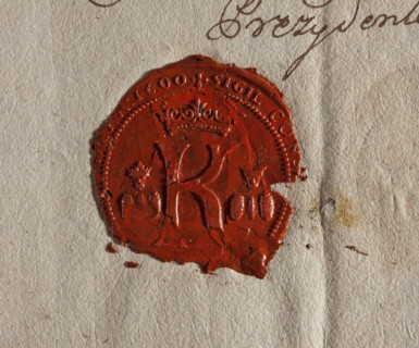 Round wax impression of the seal of Kazimierz — a suburb of Kraków. Under the royal crown the