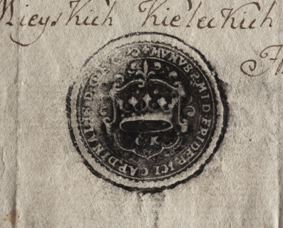 Round ink print of the seal of the city of Kielce. On the decorative shield a crown; under it the