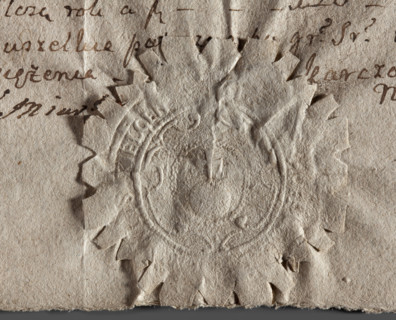 Round seal impression of the city of Kielce. On a baroque shield in a pearl-shaped rim — the world
