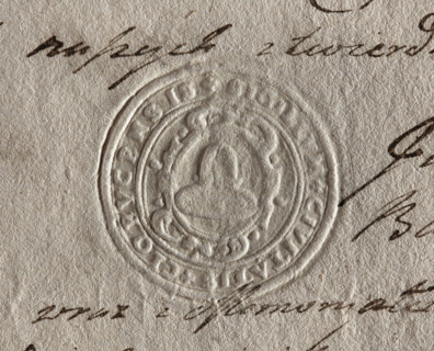 Round seal impression of the town of Klobuck, Kraków Voivodeship. On a decorative Baroque shield, a