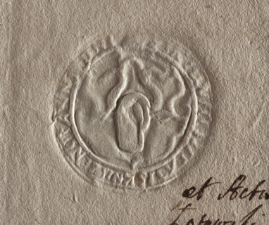 Round seal impression of the town of Knyszyn, Podlaskie Voivodeship. On the shield an outline of an