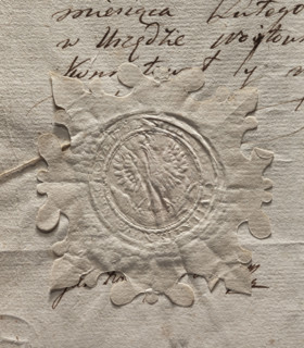 Round seal impression of the town of Nieszawa. A crowned eagle holding a large fish in its talons.