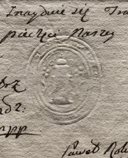 Oval seal impression of the town of Opatówka. Illegible drawing, probably a tower topped with a