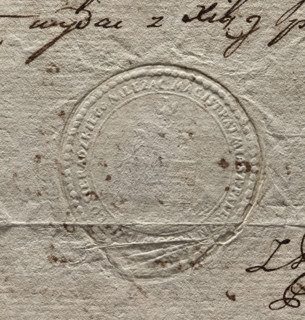 Round seal impression of the town of Pajeczno. City wall with three towers and an open gate. An