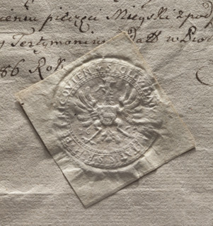 Round seal impression of the town of Piotrków. A crowned eagle with a shield bearing the Ciolek