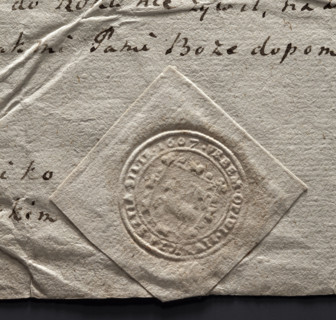 Round seal impression of the town of Piwniczna. On a baroque shield, a lamb turned to the right,