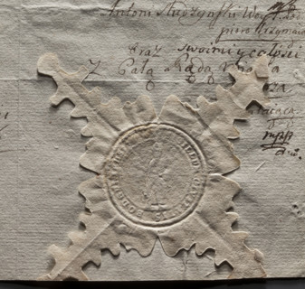 Round seal impression of the town of Podgórz. In the field of the seal, a standing figure of a