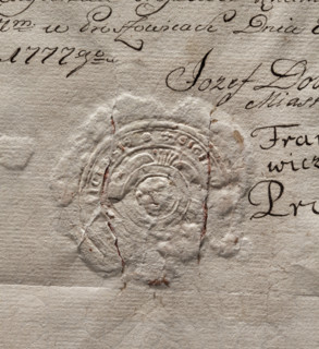 Round seal impression of the town of Proszowice, Kraków Voivodeship. In a round, baroque cartouche