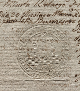 Round seal impression of the town of Przyrów. City wall with three towers, the middle one higher,