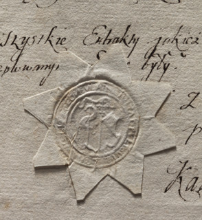 Round seal impression of the town of Pultusk. In a decorative cartouche, a cross with a pennant and