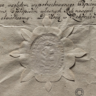 Oval seal impression of the town of Rakoniewice. In the central field, a tree trunk with knots