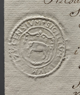 Oval seal impression of the town of Stezyca. In the decorative cartouche a pig facing right.