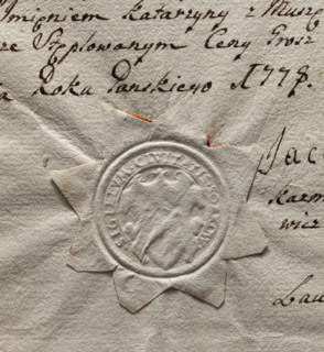 Round imprint of the seal of the town of Sobków. Illegible drawing in the decorative cartouche.