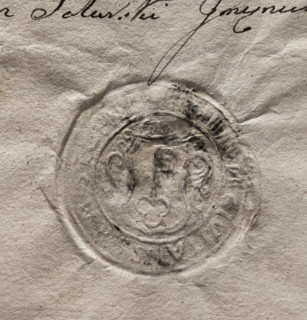 Round seal impression of the town of Stopnica. In a decorative cartouche, a key with its teeth up.