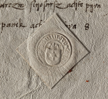 Round dry seal impression of the town of Tarnów. On the shield the Leliwa coat of arms with a jewel