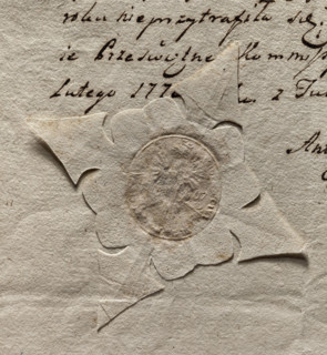 Oval seal impression of the town of Tuszyn. Crowned eagle. On the sides the date 15 67. Illegible