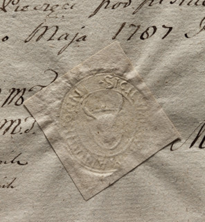 Oval impression of the seal of the town of Tykocin. On the shield there is a bison's head with