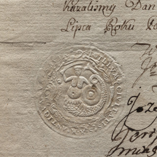 Round impression of the seal of the city of Warsaw. In a Baroque cartouche a mermaid with a fish