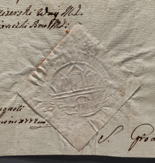 Round dry impression seal of the town of Zarki, Czestochowa Voivodeship. Depicts city wall with a