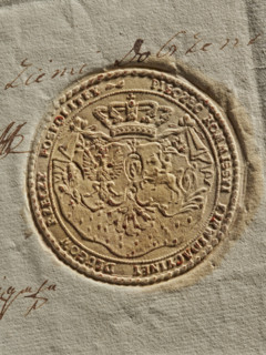 Round seal of the Debt Liquidation Commission of the Republic of Poland. On the ermine cloak, under