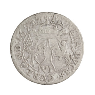 Obverse: in the border, a male bust in armor and a wig turned to the right, dividing the