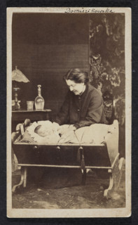 Portrait of Celina Dominikowska née Tretery (?–1910) with Kordzio in a cradle. Photographer: F.