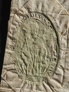 Official seal, archbishop's curia; two seal impressions on a document. Each impression shows a
