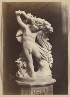 Photograph of a sculpture by Wiktor Brodzki from ca. 1868 depicting a putto with an ivy branch;