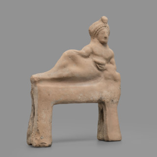 Figurine of a feasting Dionysus, author Scen.Gal.Klass. Figurine of a feasting man resting on a bed