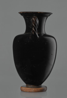 Black-finished amphora, engobe, amphoras, ancient vessels, reddish clay. Surface finished with a