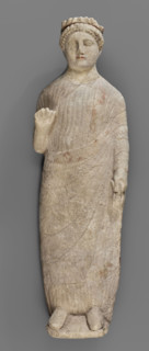 Votive figure of a youth holding a bird, votive offerings, Cypriot sculpture. Figurine of a youth