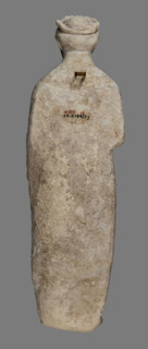 Votive figure of a youth holding a bird, votive offering, Cypriot sculpture. Figurine of a youth