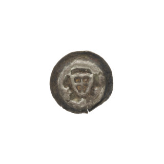 Denarius (bracteate). One-sided coin depicting a triangular shield with a cross whose arms reach