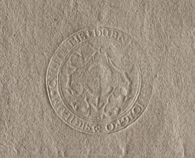 Round seal impression of the town of Dubno, Volhynian Voivodeship. Among stylized plants, the coat