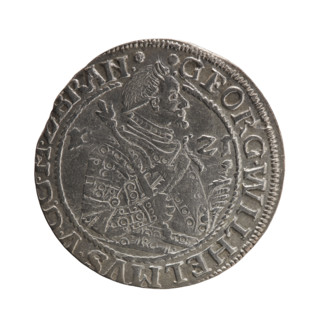 Obv: Bust in decorative armor girded with a sash turned right. In his right hand a sceptre, the