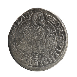 Obv. A bust in armor turned right, girded with a sash, a sceptre in his right hand. In front of the