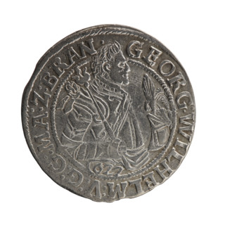 Obv. A bust in armor turned right, girded with a sash, a sceptre in his right hand. In front of the