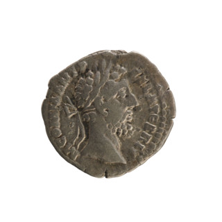 Denarius of Commodus (161–192 CE). Obverse: Emperor's head right, wearing a laurel wreath;