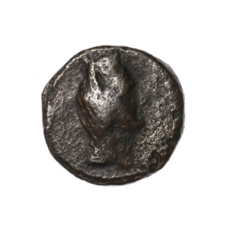 Bronze coin, Pantikapaion (as Kaisarea). Obverse: woman's head in kalathos and veil (Aphrodite