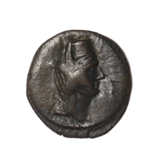 Bronze coin, Pantikapaion (as Kaisarea). Obverse: woman's head in kalathos and veil (Aphrodite