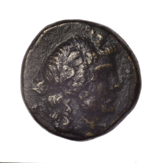 Bronze coin, Pantikapaion; obverse: head of young Dionysus in ivy wreath facing right; reverse: bow