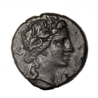 Bronze coin, Pantikapaion. Obverse: head of young Dionysus in an ivy wreath facing right. Reverse: