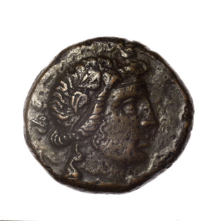 bronze coin, Pantikapaion; obv.: head of young Dionysus in an ivy wreath facing right; reverse: bow