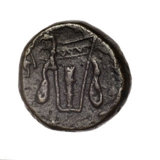 bronze coin, Pantikapaion; obv.: head of young Dionysus in an ivy wreath facing right; rv.: bow and